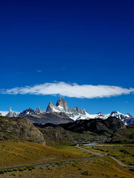 Fitz Roy peaks above a valley town