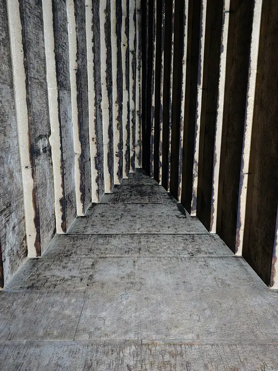 Stone corridor narrowing into darkness