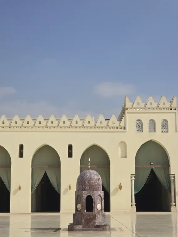 Mosque courtyard with arches and a fountain