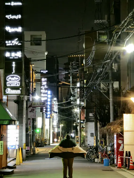 Night street lit by neon signs